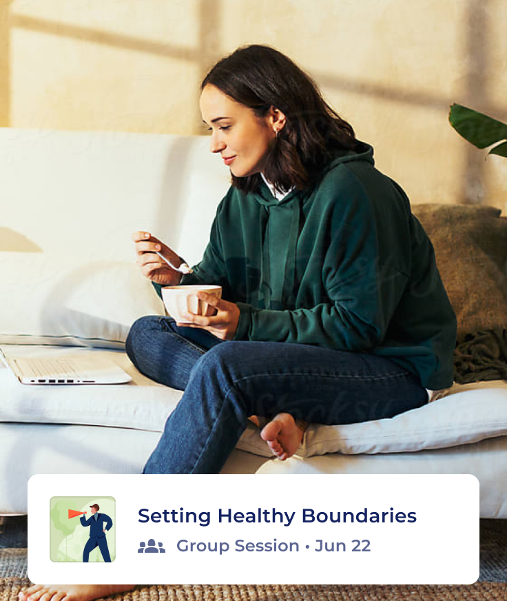 A woman sits on a sofa in a casual outfit, holding a smartphone and a mug, with her laptop and other tech devices in front of her. A banner below reads “Setting Healthy Boundaries - Group Session · Jun 22.”.